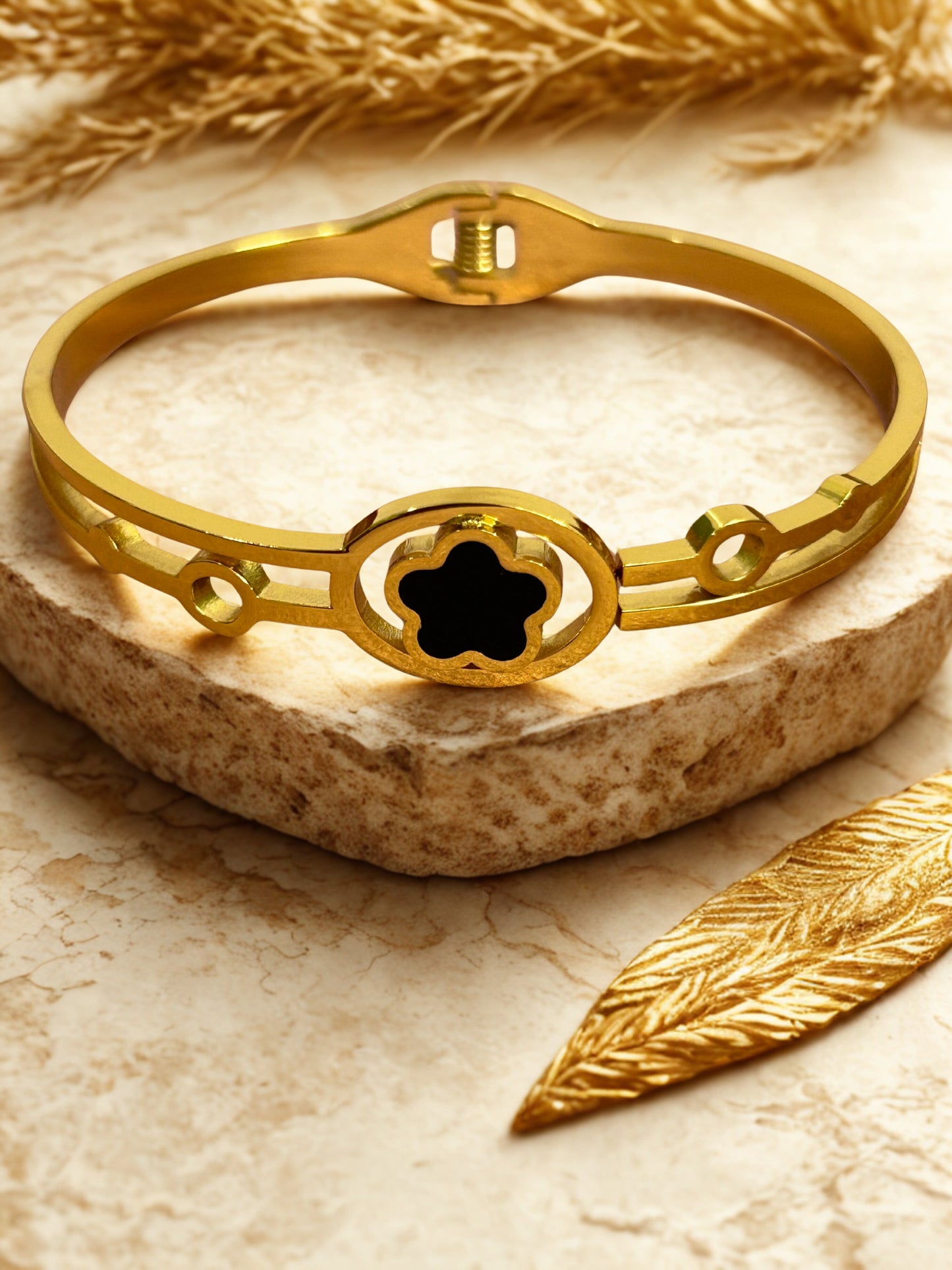 Elegant Gold-Tone Bangle with Black Clover Motif