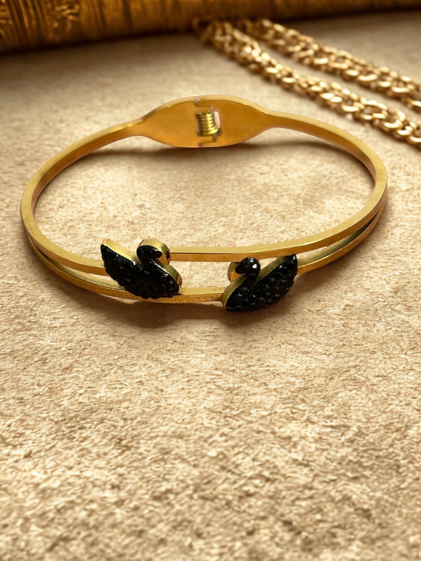 Elegant Swan Design Gold-Tone Bangle